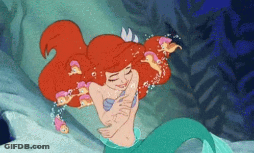 Ariel From The Little Mermaid Is Hugging A Group Of Little Mermaids In The Ocean . GIF