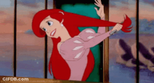 Ariel From The Little Mermaid Is Standing In Front Of A Window GIF
