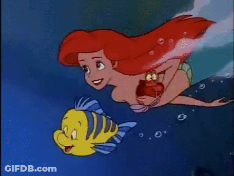 Ariel From The Little Mermaid Is Swimming With A Yellow Fish . GIF