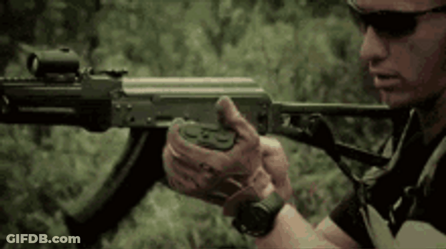 Armored Guy Loading A Gun GIF