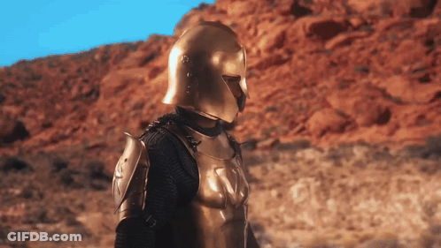 Armored Man With Gold Helmet In Desert GIF