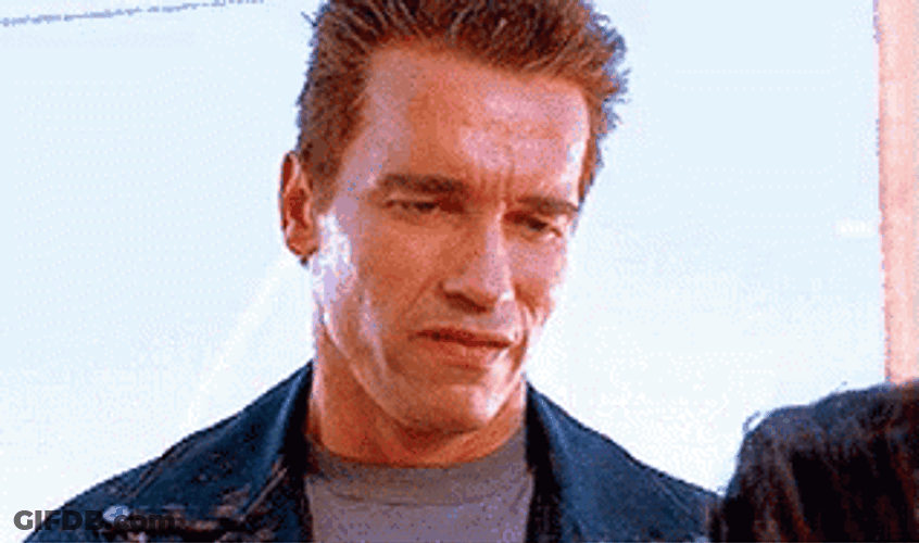 Arnold Schwarzenegger Annoyed Smile GIF