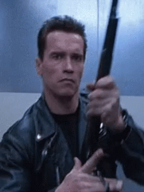 Arnold Schwarzenegger Cocking Gun GIF
