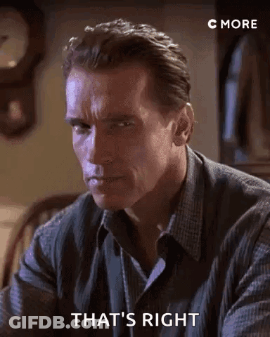 Arnold Schwarzenegger Is Sitting At A Table With A Clock In The Background And Saying `` That 'S Right '' . GIF