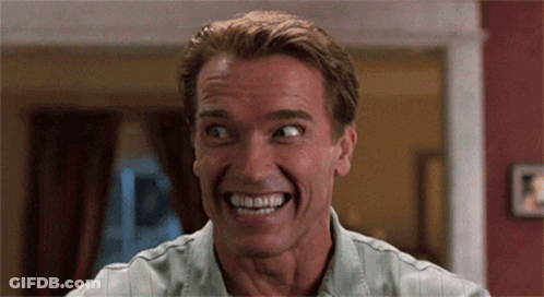 Arnold Schwarzenegger Is Smiling With His Mouth Open GIF