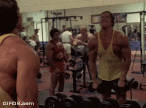 Arnold Schwarzenegger Lifting Dumbbell GIF