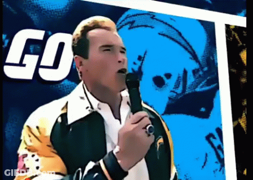 Arnold Schwarzenegger Singing Into Microphone In Front Of Go On It Sign GIF
