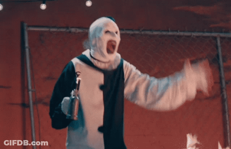 Art The Clown Holding Mini Fire Torch GIF