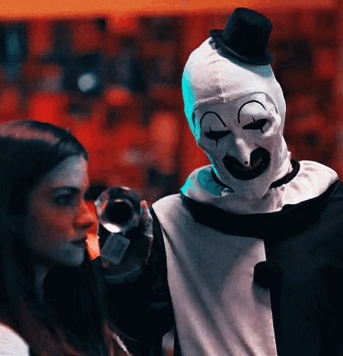 Art The Clown Scares Girl GIF