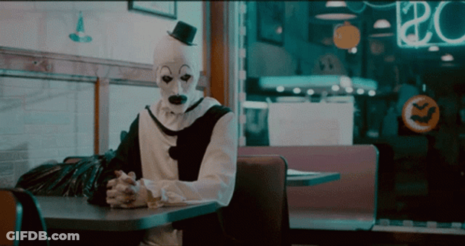 Art The Clown Smile Then Serious GIF