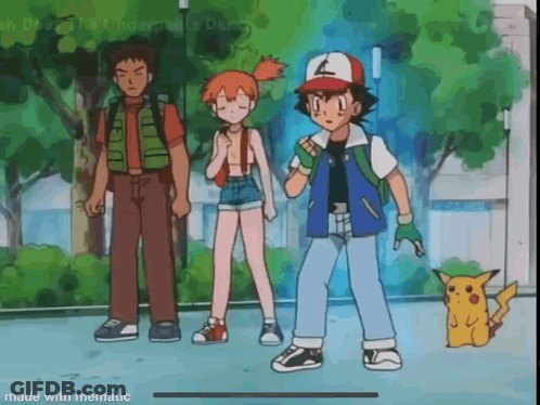 Ash , Misty , And Pikachu Are Standing Next To Each Other On A Sidewalk In A Park . GIF