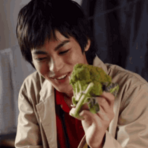 Asian Guy Holding Broccoli GIF