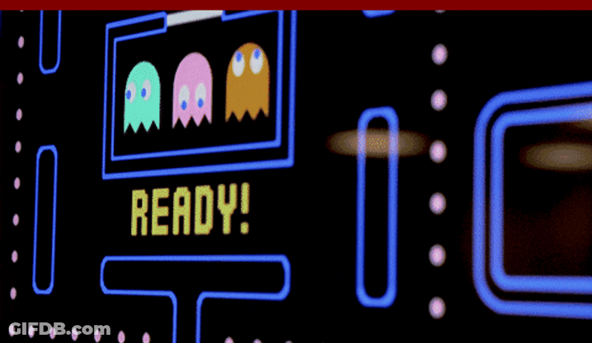Asian Guy Playing Pac Man On Big Screen GIF
