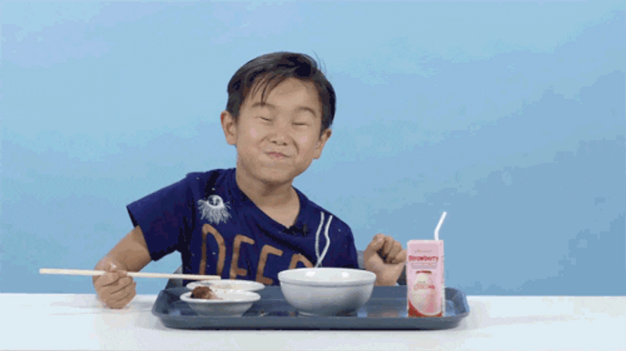 Asian Kid Tries Food Satisfied GIF