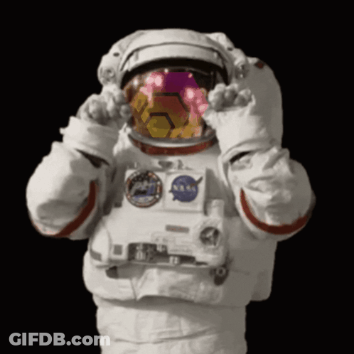 Astronaut In NASA Helmet And Gloves Covering Eyes GIF