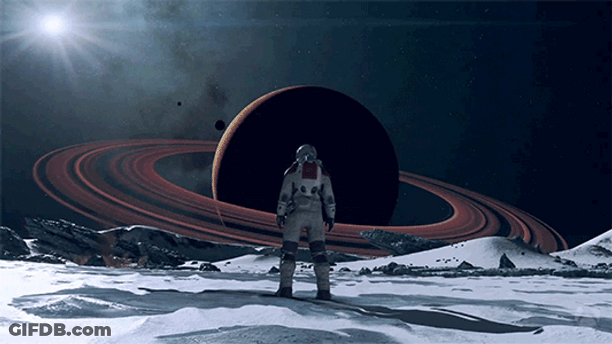 Astronaut Looking At Saturn GIF