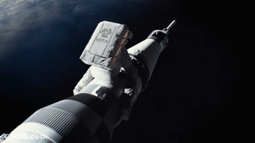 Astronaut With Iota Riding Rocket GIF