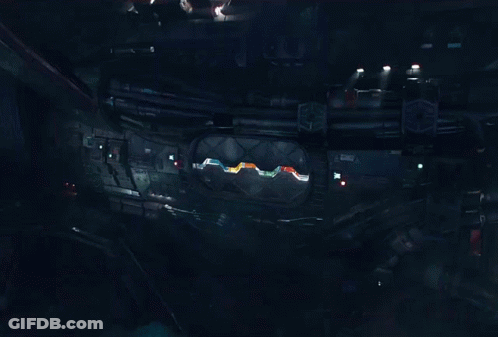 Astronauts Flying Through Space With Orange Suit GIF