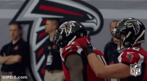 Atlanta Falcons Football Players Hugging NFL Logo GIF