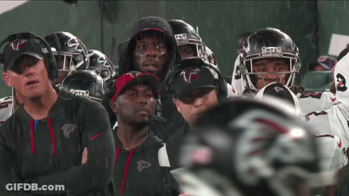 Atlanta Falcons Football Players Standing In Rain GIF