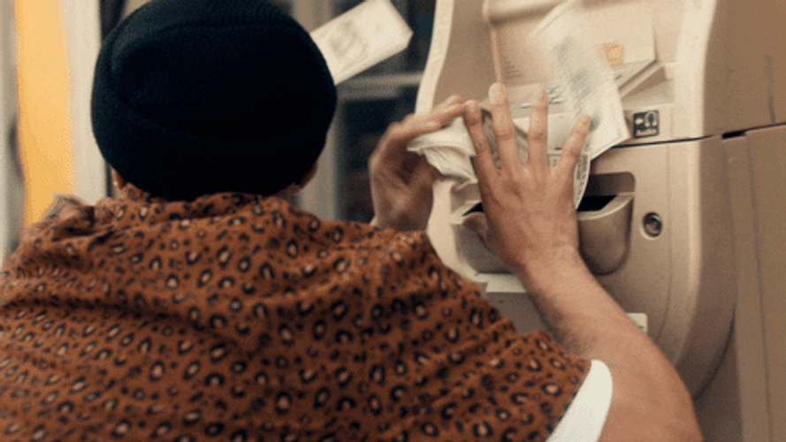 ATM Machine Dispensing A Lot Of Dollar Bills GIF
