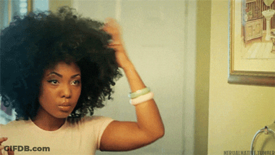 Attractive Black Woman Adjusting Afro Volume GIF