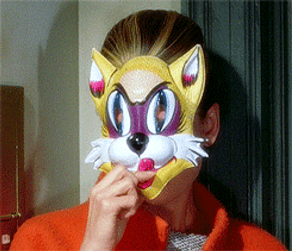 Audrey Hepburn Taking Off Mask GIF