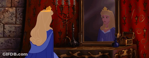 Aurora Looking At Her Reflection In Mirror GIF
