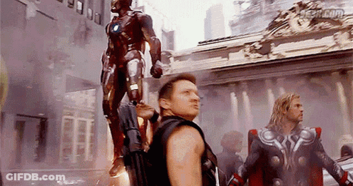Avengers Standing Before Iron Man Statue GIF