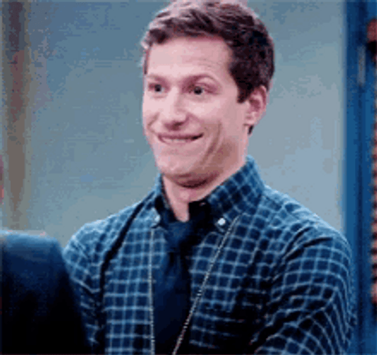 Awkward Lip Bite Andy Samberg GIF