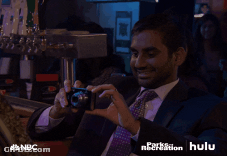 Aziz Ansari Taking Pictures Parks And Recreation GIF