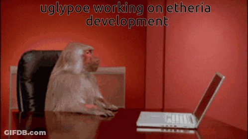 Baboon At Laptop With Uglypoe Working On Etheria Development GIF