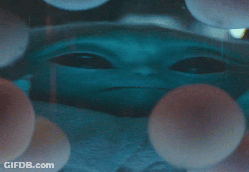 Baby Alien Surrounded By Balls GIF
