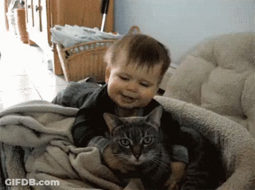 Baby And Cat Looking At Each Other GIF
