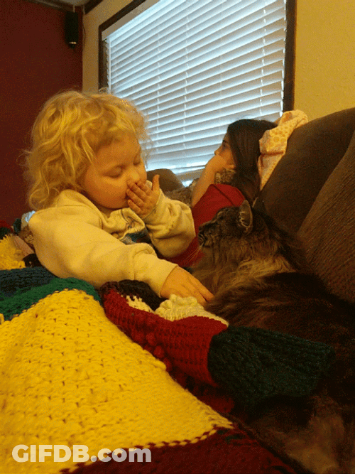 Baby Blowing Kisses To Her Cat GIF