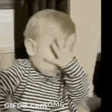 Baby Covering Face Black And White GIF