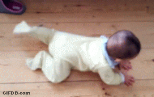 Baby Crawling On Wooden Floor Blurry Photo GIF