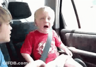 Baby Crying In Car Seat With Woman GIF