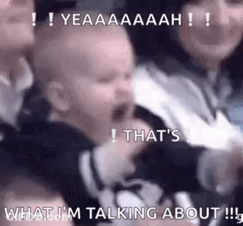 Baby Crying In Crowd Held By Woman GIF
