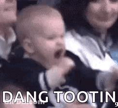 Baby Crying In Woman's Arms In Chair GIF