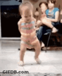 Baby Dancing On Tiled Floor While Woman Holds Another GIF