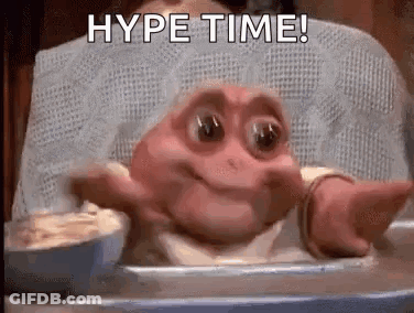 Baby Dinosaur Sitting In High Chair With Bowl Of Food GIF