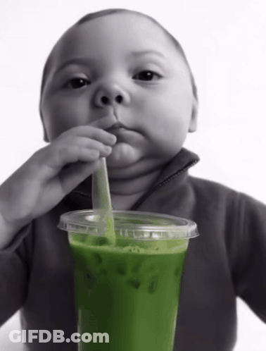 Baby Drinking Green Drink With Straw GIF