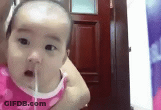 Baby Drinking Water From Straw In Woman's Arms GIF