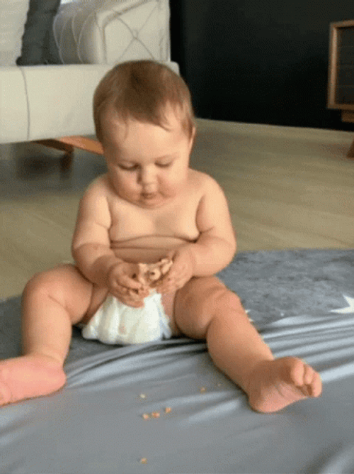 Baby Eating Happily GIF