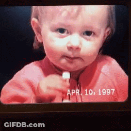 Baby Face On Screen With Date April 10 1997 GIF