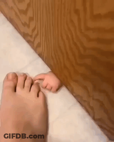 Baby Feet Sticking Out Of Door GIF