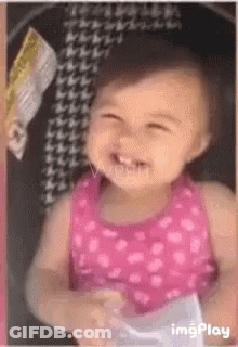 Baby Girl In Pink Dress Smiling In Car Seat GIF