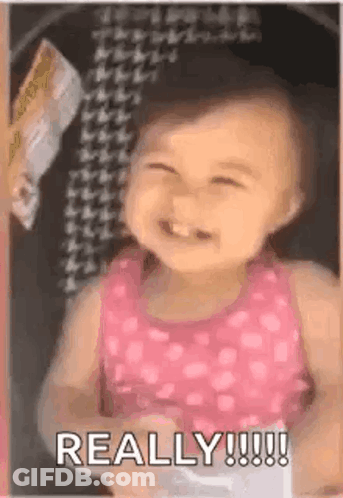 Baby Girl In Pink Tank Top Smiling GIF