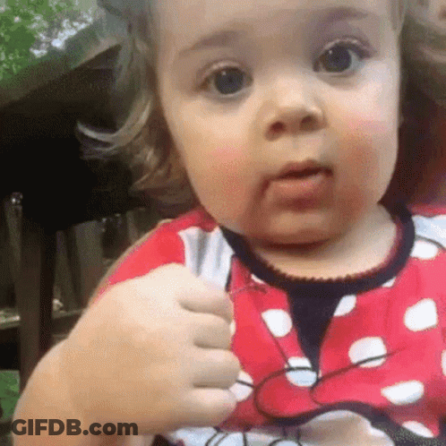 Baby Girl In Red And White Polka Dot Minnie Mouse Dress GIF